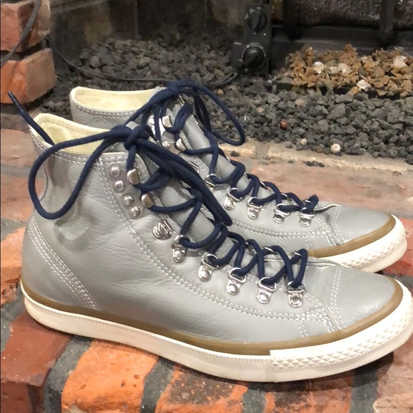 navy blue leather chuck taylors